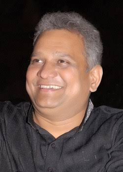 Bhupesh R. Patel photographed at an evening occasion, wearing a dark kurta